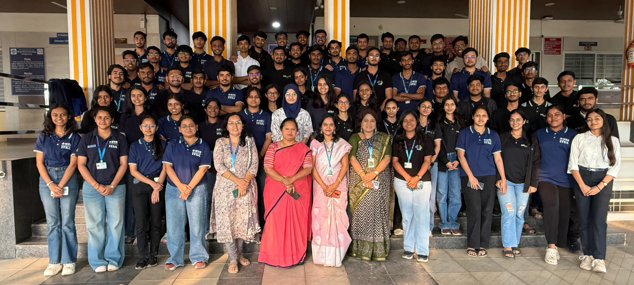 The Praxis team and faculty posing together outside the venue